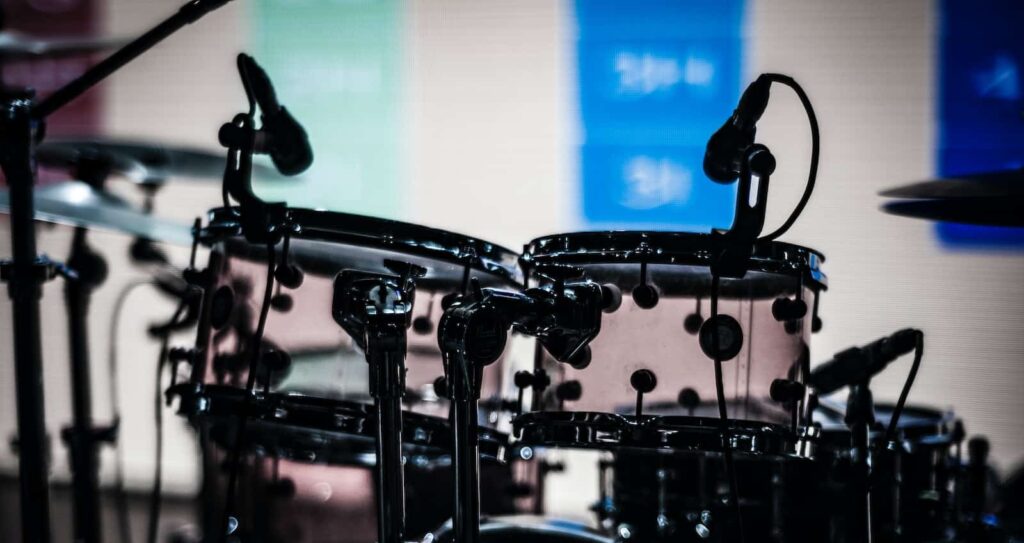 black drum set shallow focus photography